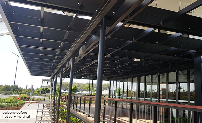 Hanging-Baskets transform new Tavern balcony from drab to cool green... image 2