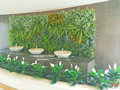 artificial plants are solution for tranquil Foyer Fountain setting...