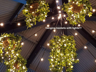 Hanging-Baskets with lights brighten up marina restaurant...