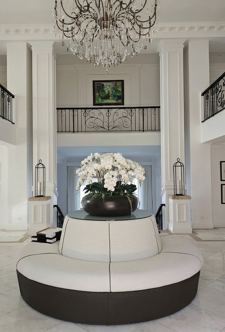 Huge artificial orchid bowl in foyer